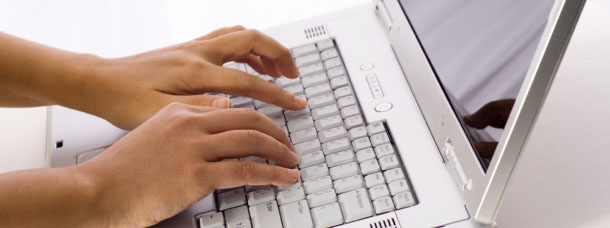 Person Typing on a Keyboard